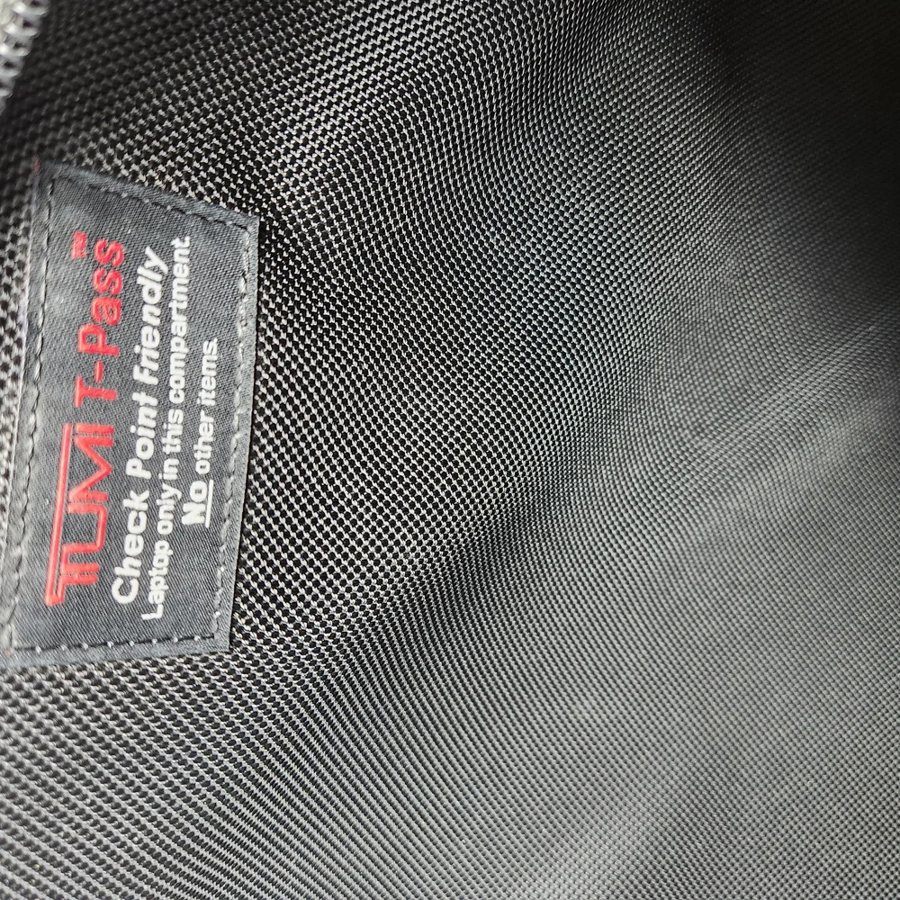 TUMI Black Briefcase with Durable Design